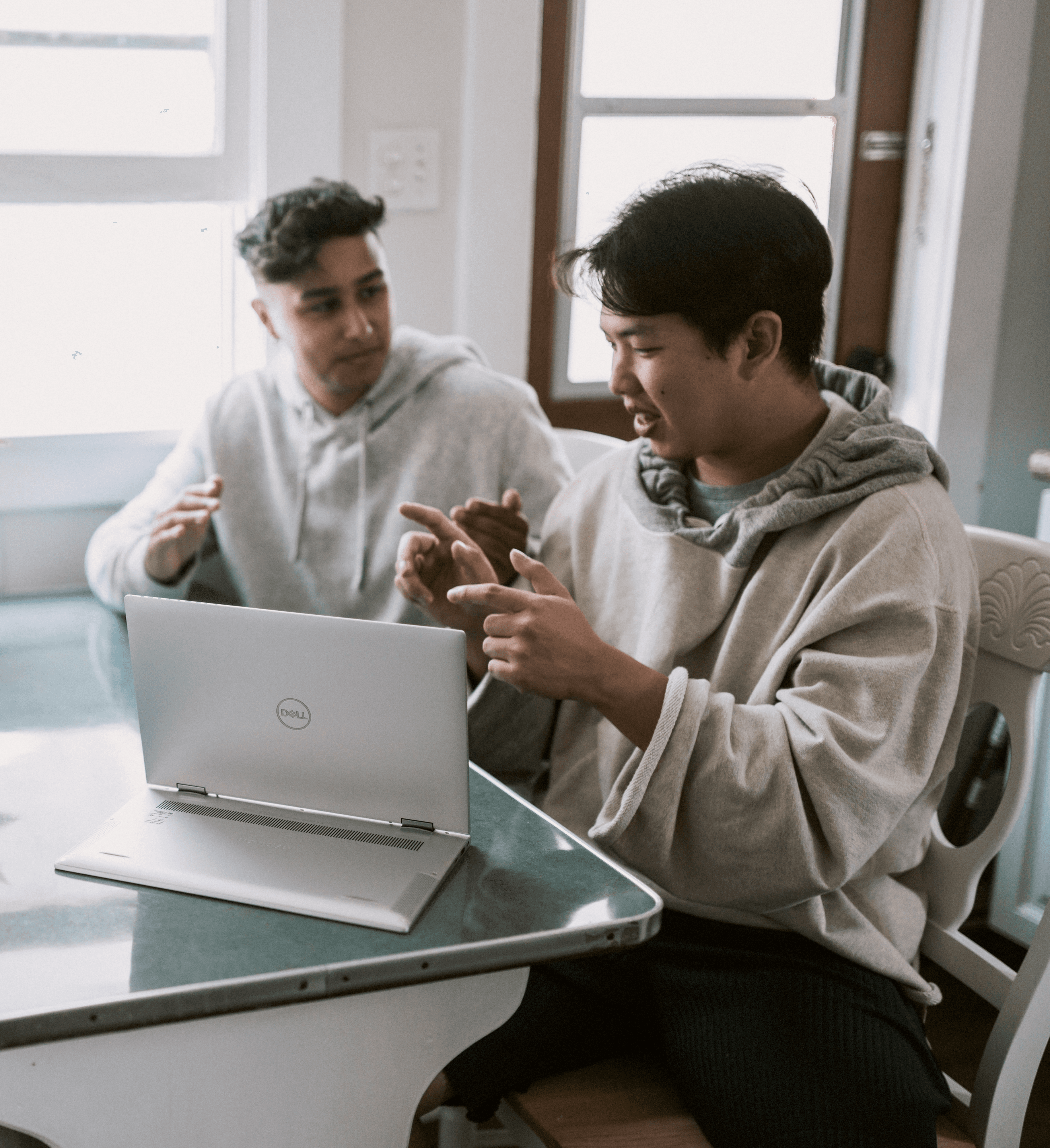 People collaborating around a laptop